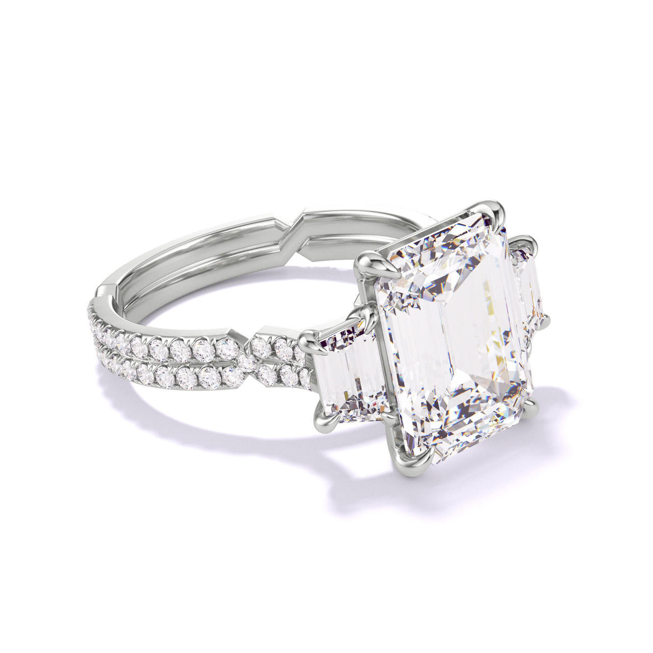 emerald cut diamond engagement ring with a trapezoid flank chance pave setting in platinum