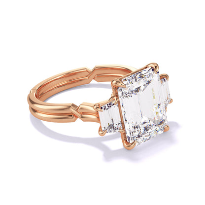 EMERALD CUT DIAMOND ENGAGEMENT RING WITH A TRAPEZOID FLANK CHANCE SETTING IN 18K ROSE GOLD