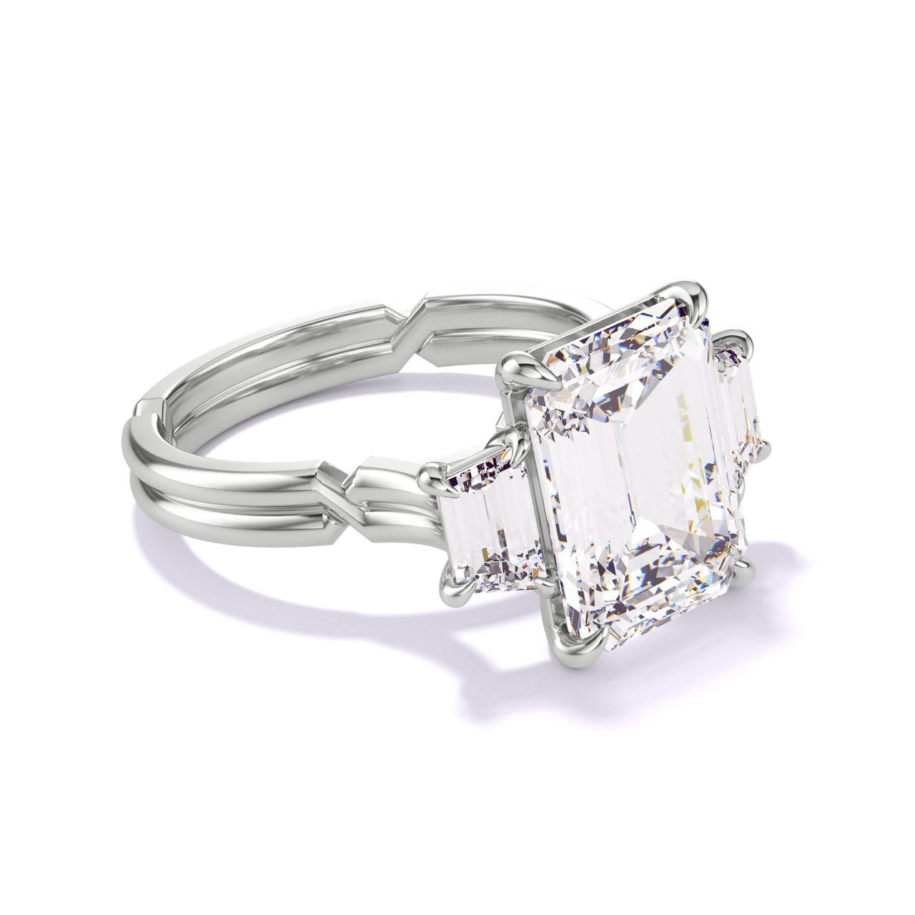 EMERALD CUT DIAMOND ENGAGEMENT RING WITH A TRAPEZOID FLANK CHANCE SETTING IN PLATINUM