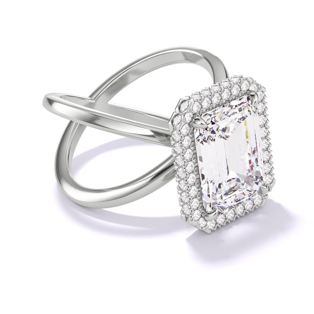 EMERALD CUT DIAMOND ENGAGEMENT RING WITH A WRAPPED HALO AXIS SETTING IN PLATINUM