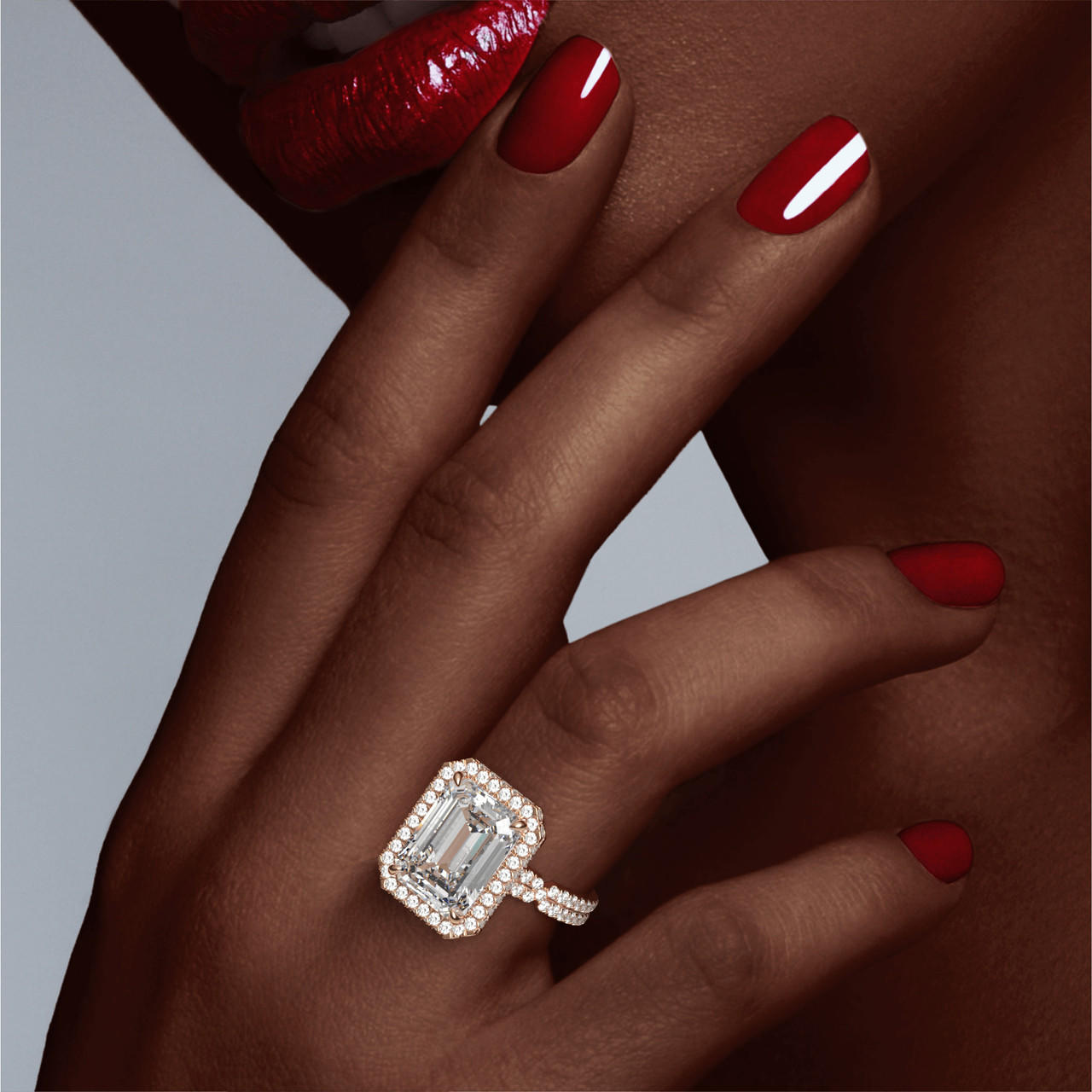 emerald cut diamond engagement ring with a wrapped halo chance pave setting in 18k rose gold