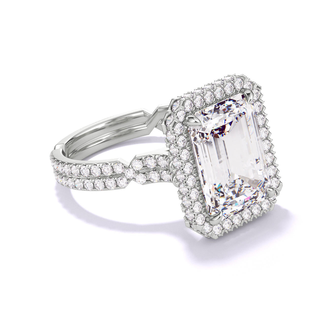 EMERALD CUT DIAMOND ENGAGEMENT RING WITH A WRAPPED HALO CHANCE PAVE SETTING IN PLATINUM