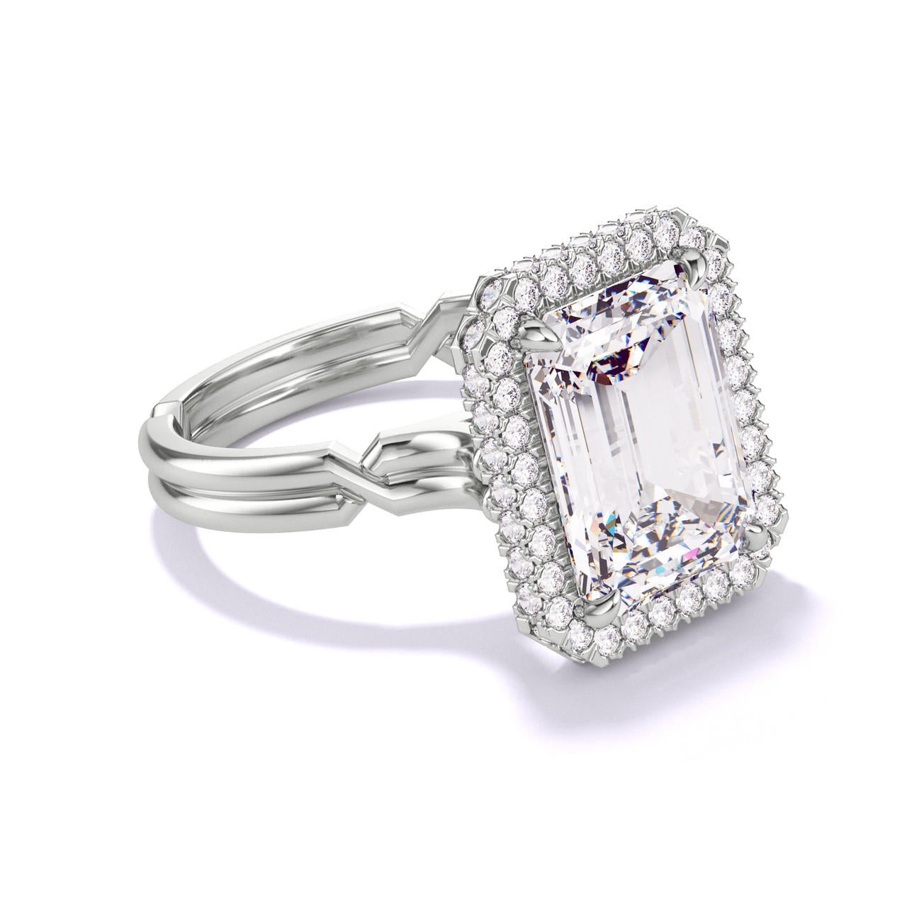 EMERALD CUT DIAMOND ENGAGEMENT RING WITH A WRAPPED HALO CHANCE SETTING IN PLATINUM