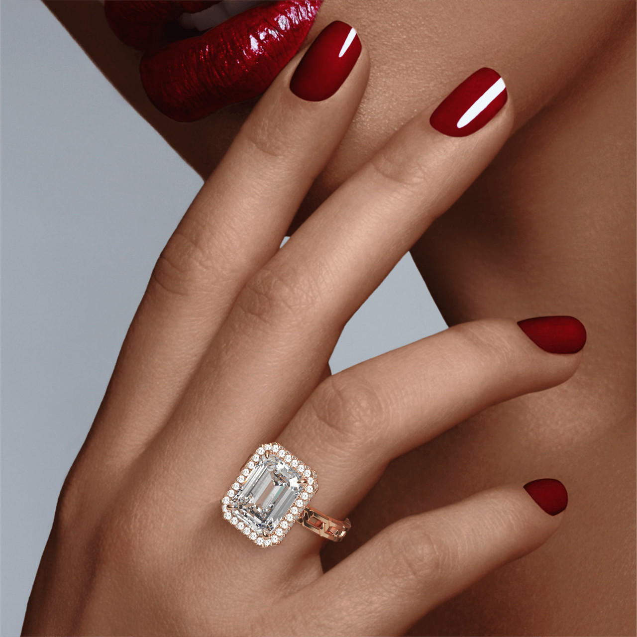 EMERALD CUT DIAMOND ENGAGEMENT RING WITH A WRAPPED HALO 16 LINKS SETTING IN 18K ROSE GOLD