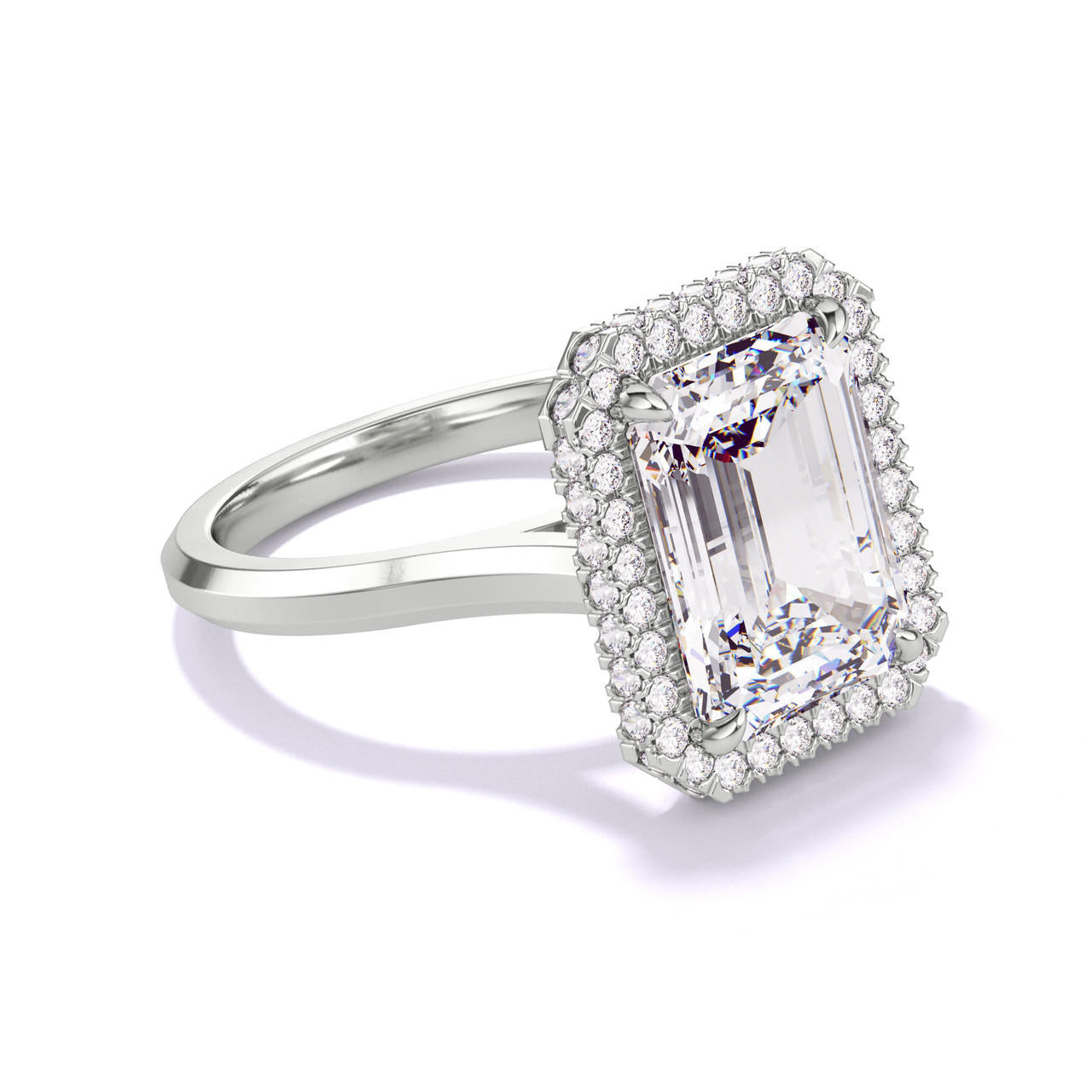 EMERALD CUT DIAMOND ENGAGEMENT RING WITH A WRAPPED HALO THREE PHASES SLIM SETTING IN PLATINUM