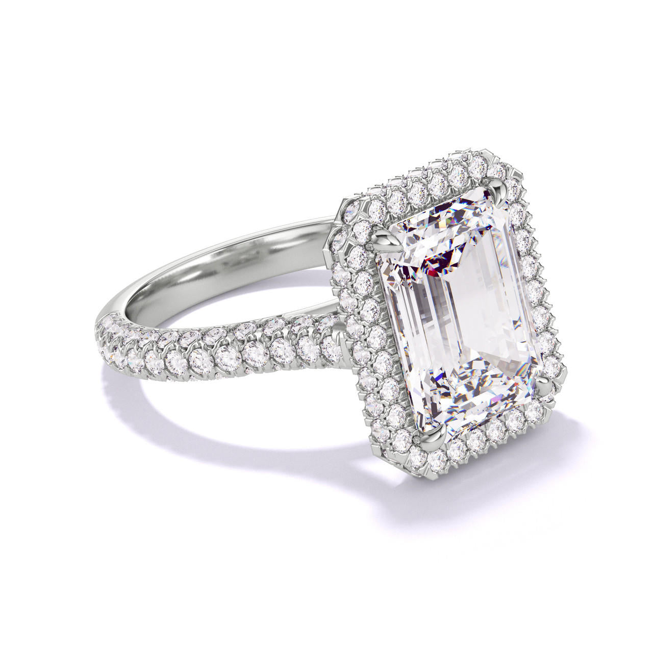 EMERALD CUT DIAMOND ENGAGEMENT RING WITH A WRAPPED HALO THREE PHASES TRIPLE PAVE SETTING IN PLATINUM