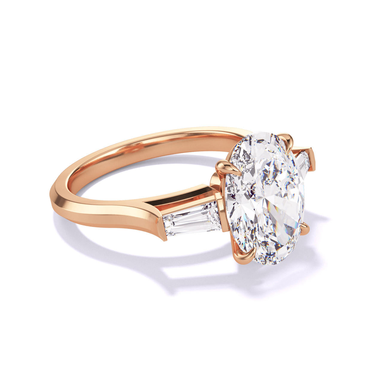 Oval engagement ring with tapered baguettes in rose gold