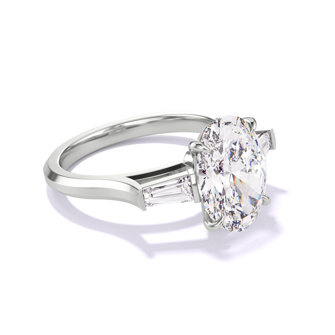 OVAL CUT DIAMOND ENGAGEMENT RING WITH A BAGUETTE FLANK THREE PHASES SLIM SETTING IN PLATINUM