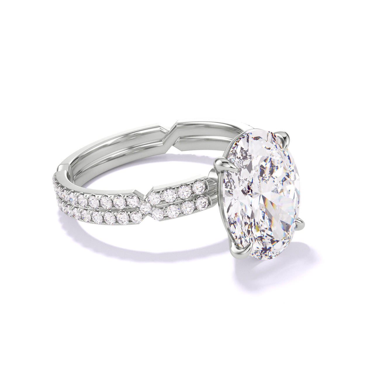 OVAL CUT DIAMOND ENGAGEMENT RING WITH A CLASSIC 4 PRONG CHANCE PAVE SETTING IN PLATINUM