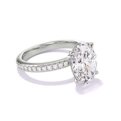 OVAL CUT DIAMOND ENGAGEMENT RING WITH A CLASSIC 4 PRONG THREE PHASES PAVE SETTING IN PLATINUM