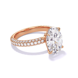 Oval Cut Diamond Engagement Ring by Lindsey Scoggins Studio, featuring a classic 4 prong three phases triple pave setting in 18k Rose Gold.