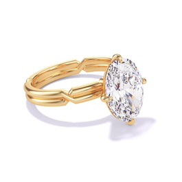 An Oval Cut Diamond Engagement Ring by Lindsey Scoggins Studio, featuring a compass 4 prong chance setting in 18k yellow gold.