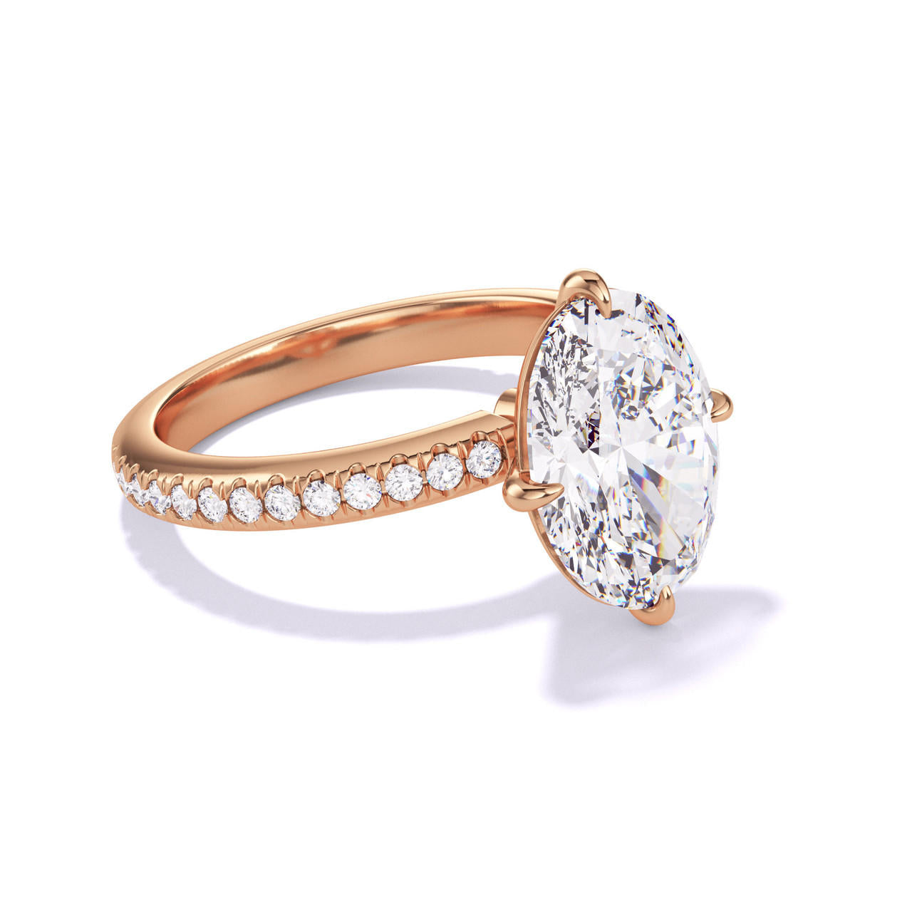 oval cut diamond engagement ring with a compass 4 prong three phases pave setting in 18k rose gold