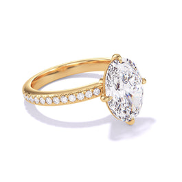 Gold Oval Engagement Ring with a Compass 4 Prong Three Phases Pave Band