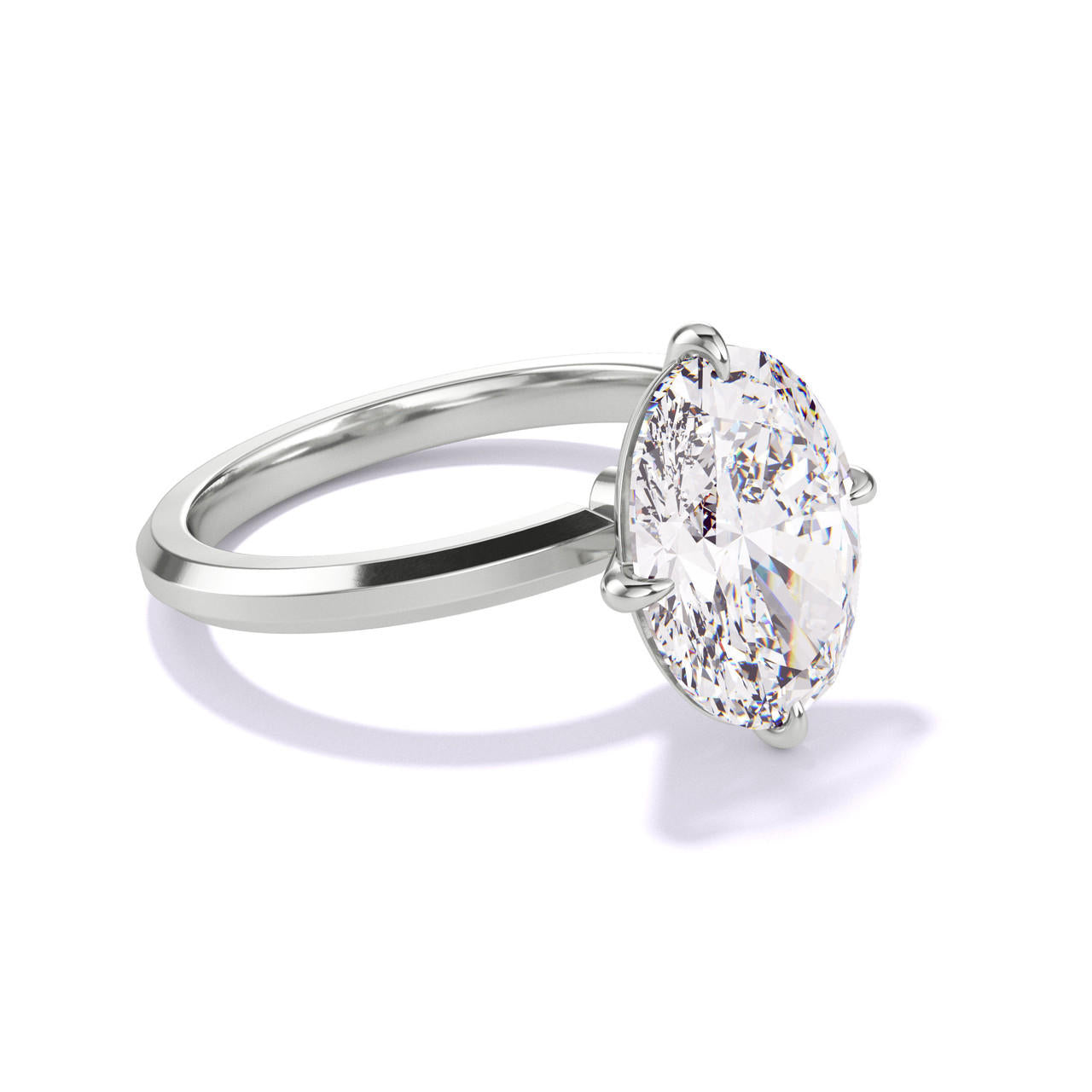 OVAL CUT DIAMOND ENGAGEMENT RING WITH A COMPASS 4 PRONG THREE PHASES SLIM SETTING IN PLATINUM