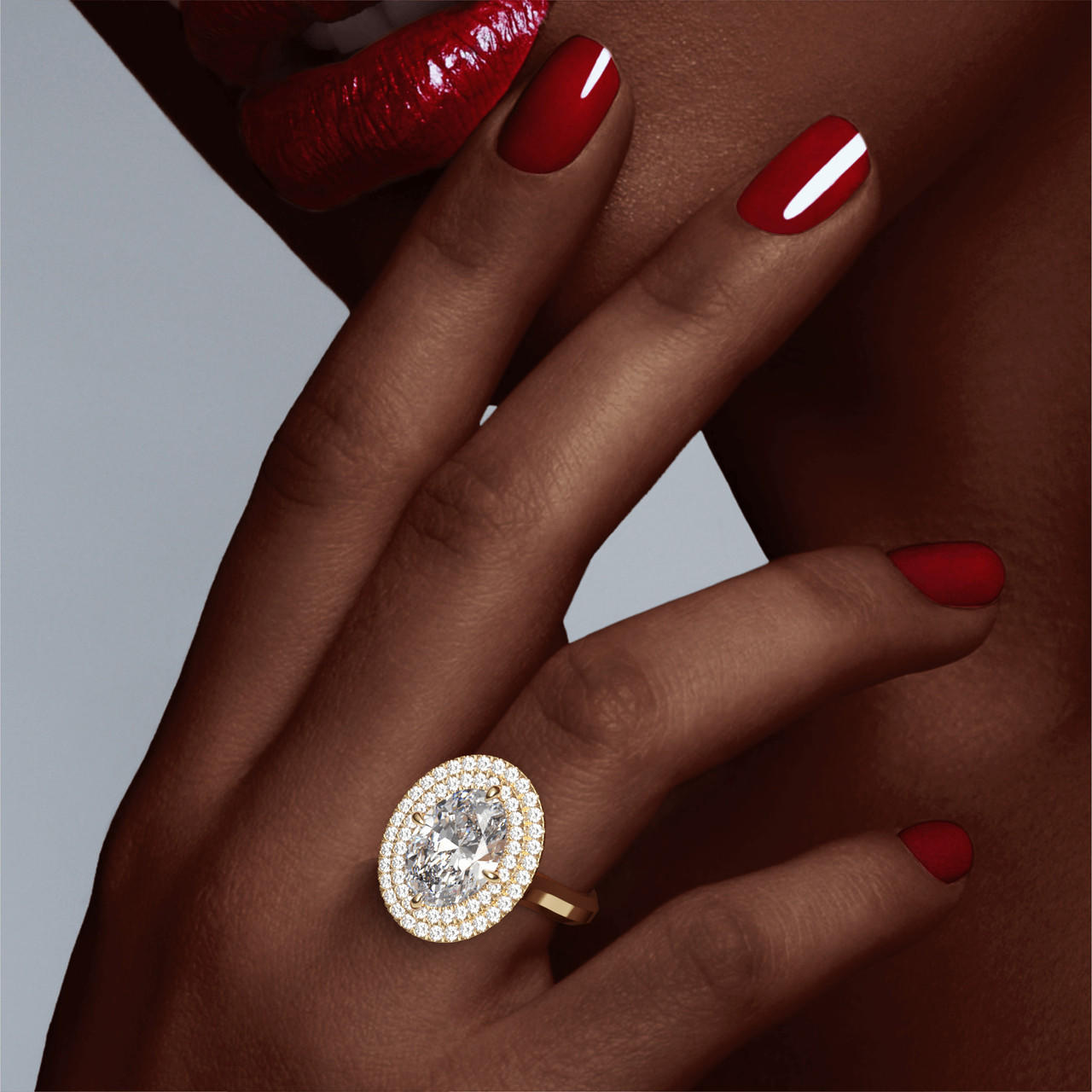 OVAL CUT DIAMOND ENGAGEMENT RING WITH A DOUBLE HALO THREE PHASES SETTING IN 18K YELLOW GOLD