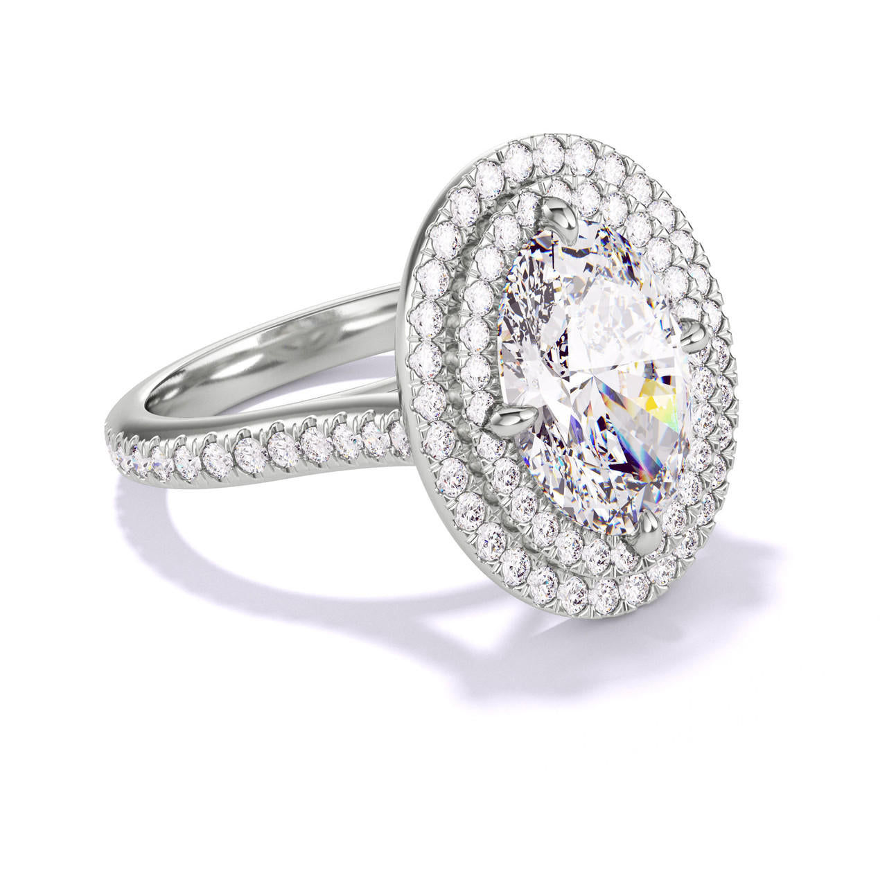 OVAL CUT DIAMOND ENGAGEMENT RING WITH A DOUBLE HALO THREE PHASES PAVE SETTING IN PLATINUM