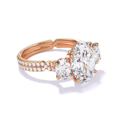 Rose Gold Oval Engagement Ring with a Three Stone Chance Pave Setting