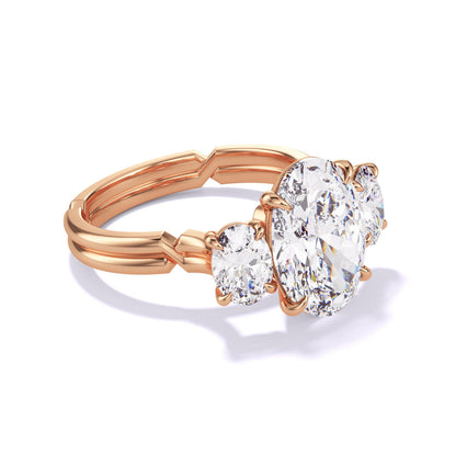 OVAL CUT DIAMOND ENGAGEMENT RING WITH A THREE STONE CHANCE SETTING IN 18K ROSE GOLD