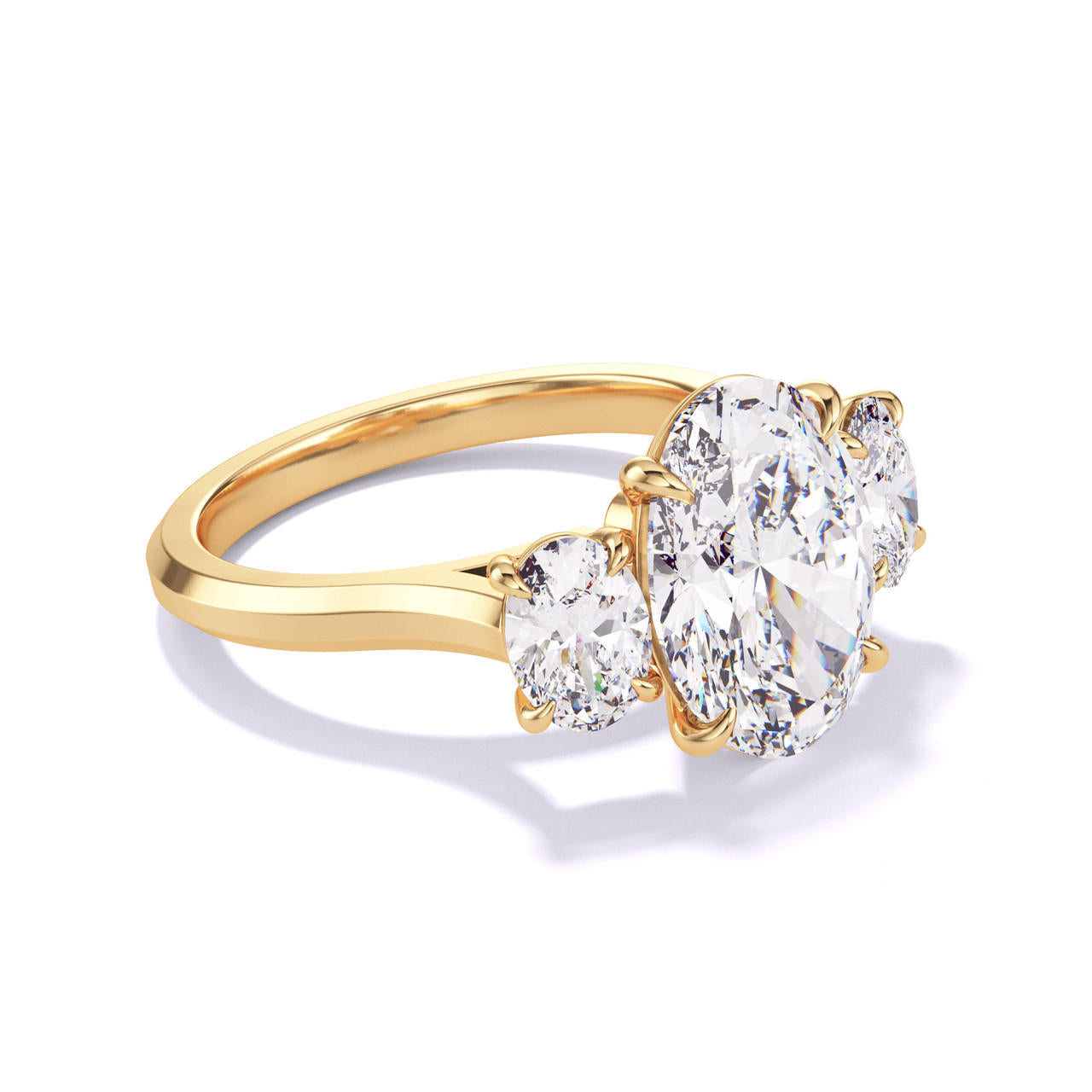 Gold Oval Engagement Ring with a Three Stone Slim Three Phases Setting