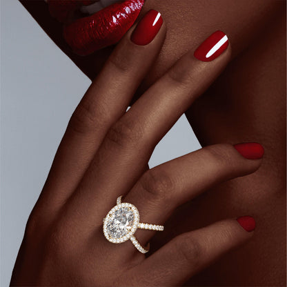 OVAL CUT DIAMOND ENGAGEMENT RING WITH A WRAPPED HALO AXIS PAVE SETTING IN 18K YELLOW GOLD