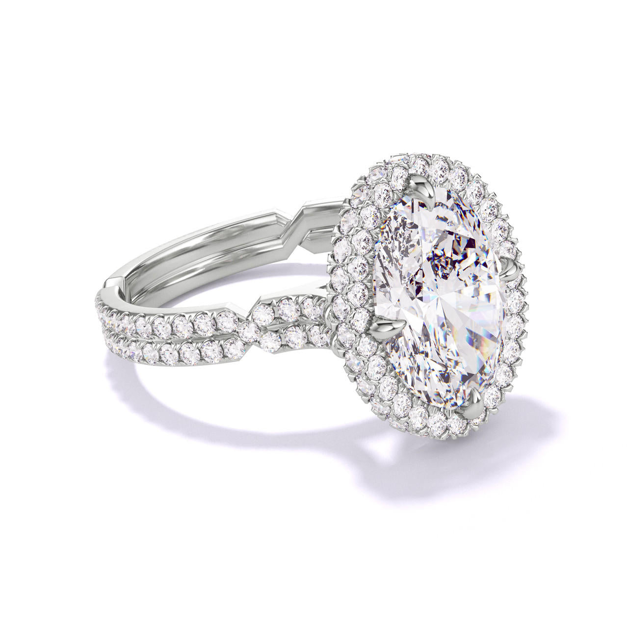 OVAL CUT DIAMOND ENGAGEMENT RING WITH A WRAPPED HALO CHANCE PAVE SETTING IN PLATINUM