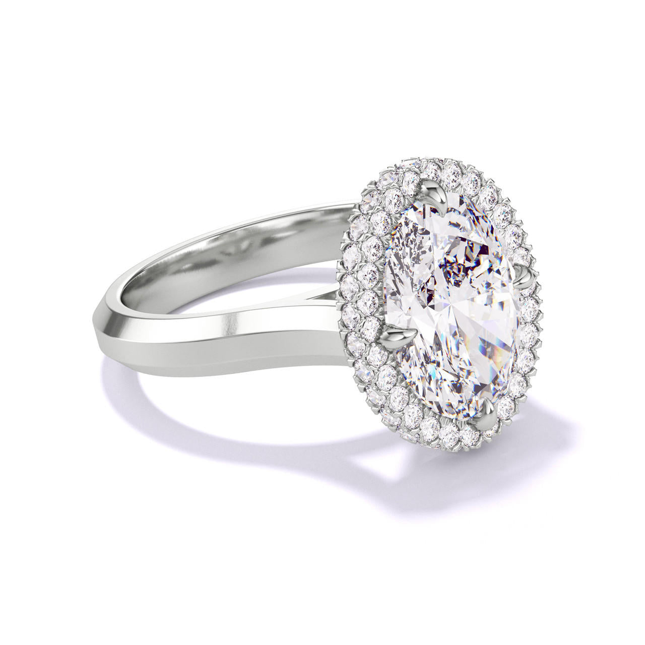 OVAL CUT DIAMOND ENGAGEMENT RING WITH A WRAPPED HALO THREE PHASES SETTING IN PLATINUM