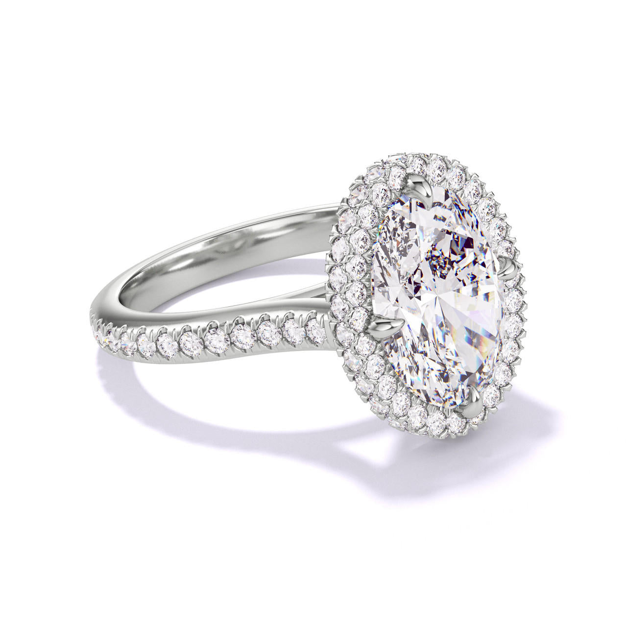 OVAL CUT DIAMOND ENGAGEMENT RING WITH A WRAPPED HALO THREE PHASES PAVE SETTING IN PLATINUM