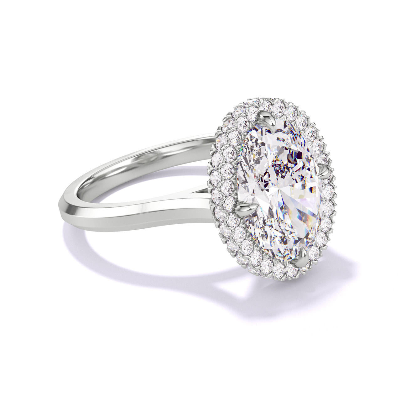 OVAL CUT DIAMOND ENGAGEMENT RING WITH A WRAPPED HALO THREE PHASES SLIM SETTING IN PLATINUM