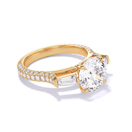 ROUND CUT DIAMOND ENGAGEMENT RING WITH A BAGUETTE FLANK THREE PHASES TRIPLE PAVE SETTING IN 18K YELLOW GOLD