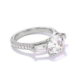 Platinum Round Engagement Ring with a Baguette Flank Pave Band Setting