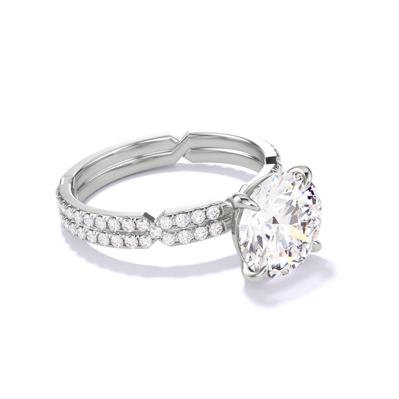 ROUND CUT DIAMOND ENGAGEMENT RING WITH A CLASSIC 4 PRONG CHANCE PAVE SETTING IN PLATINUM