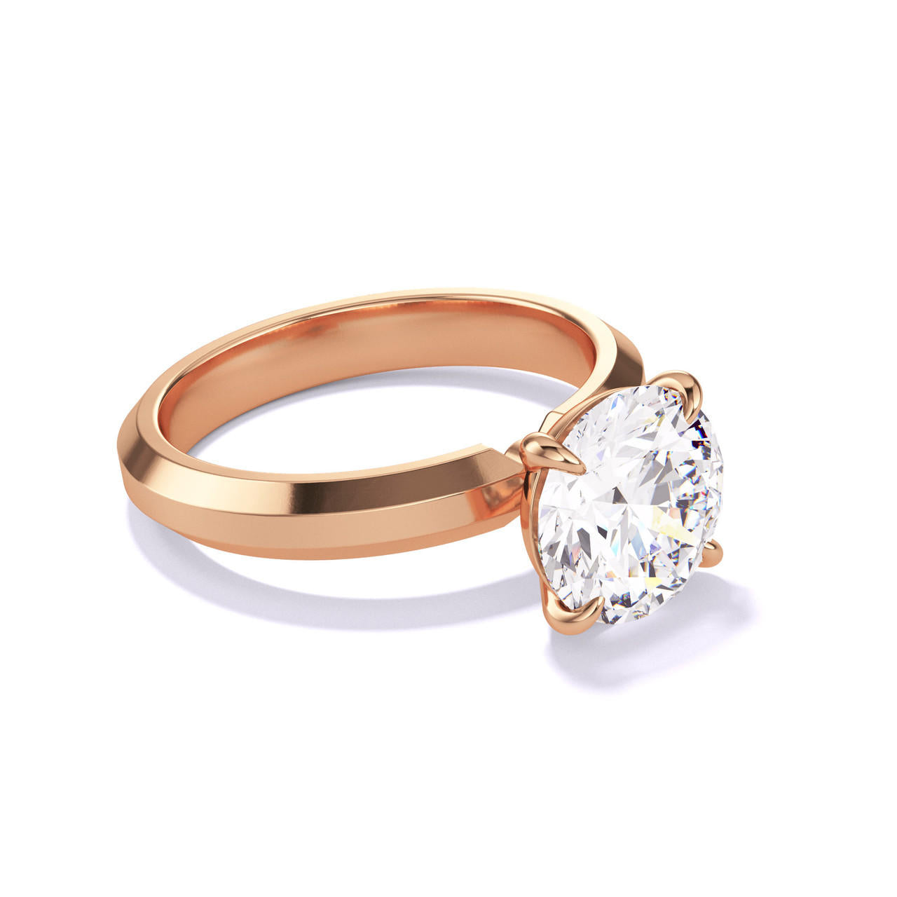 ROUND CUT DIAMOND ENGAGEMENT RING WITH A CLASSIC 4 PRONG THREE PHASES SETTING IN 18K ROSE GOLD