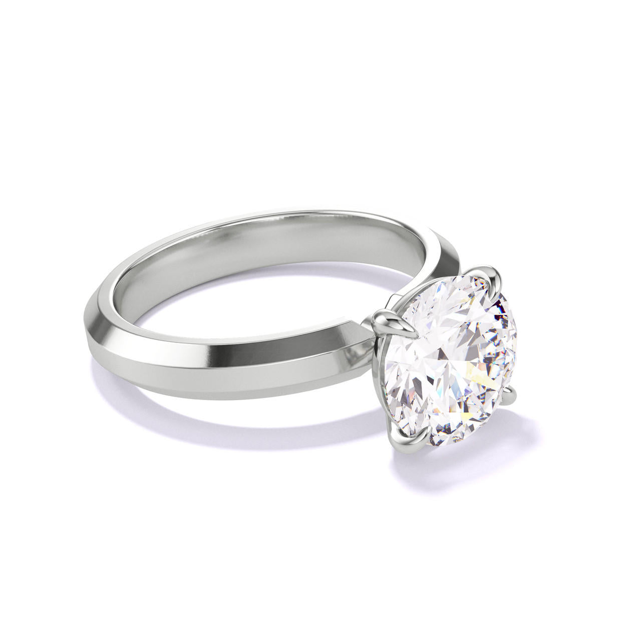 ROUND CUT DIAMOND ENGAGEMENT RING WITH A CLASSIC 4 PRONG THREE PHASES SETTING IN PLATINUM