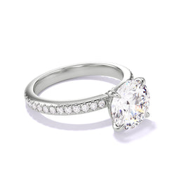 Classic Round Engagement Ring with a four prong setting on a pave band in platinum