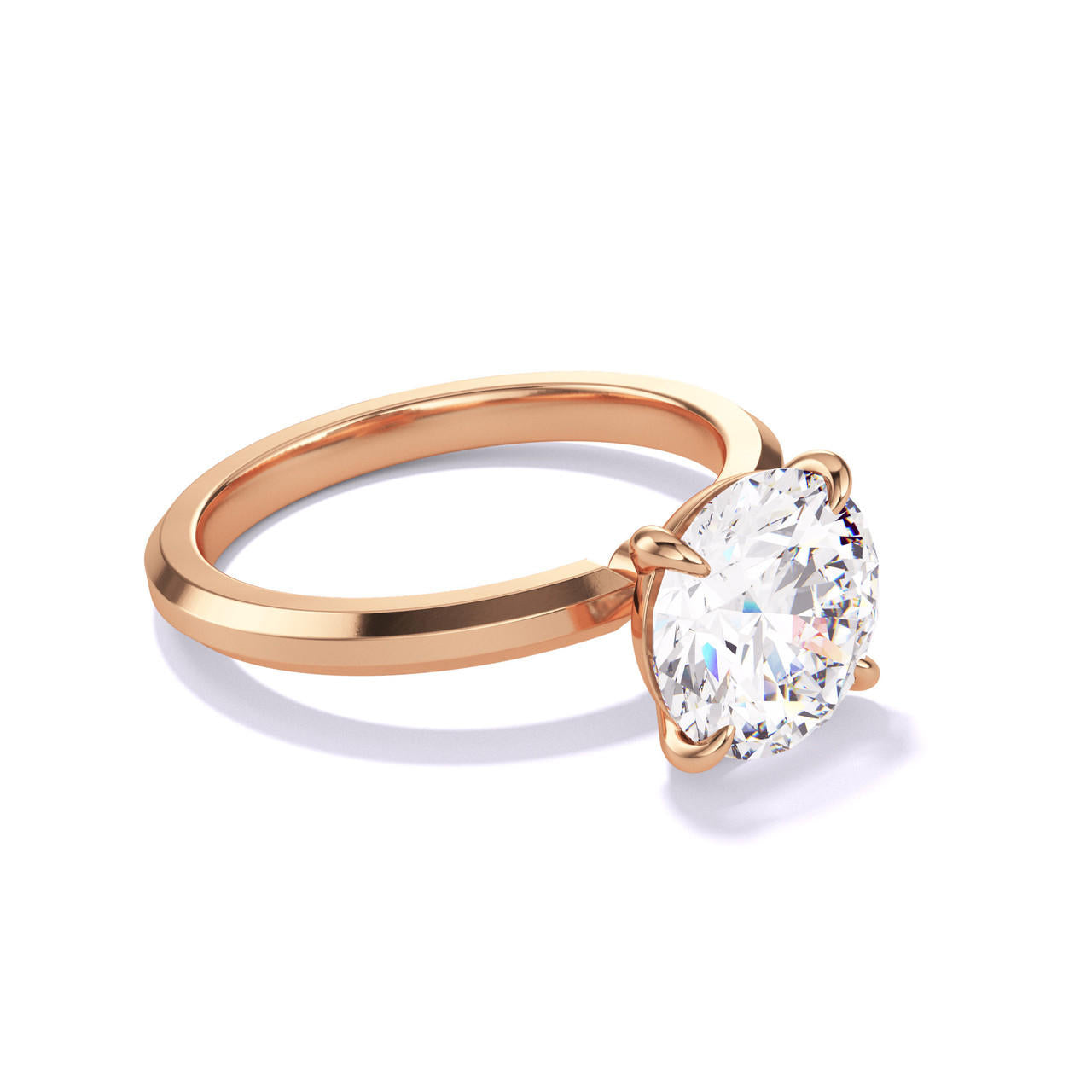 ROUND CUT DIAMOND ENGAGEMENT RING WITH A CLASSIC 4 PRONG THREE PHASES SLIM SETTING IN 18K ROSE GOLD