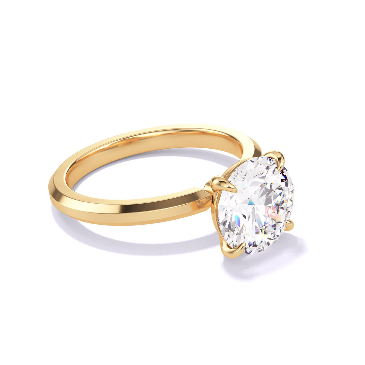 ROUND CUT DIAMOND ENGAGEMENT RING WITH A CLASSIC 4 PRONG THREE PHASES SLIM SETTING IN 18K YELLOW GOLD