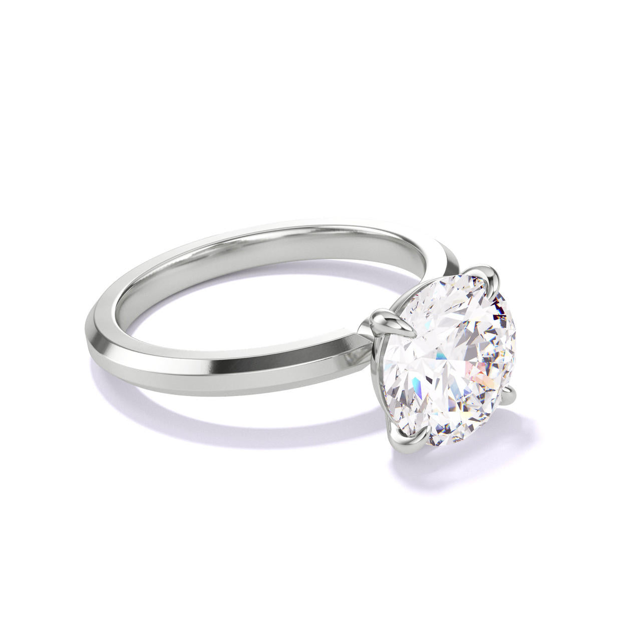 ROUND CUT DIAMOND ENGAGEMENT RING WITH A CLASSIC 4 PRONG THREE PHASES SLIM SETTING IN PLATINUM