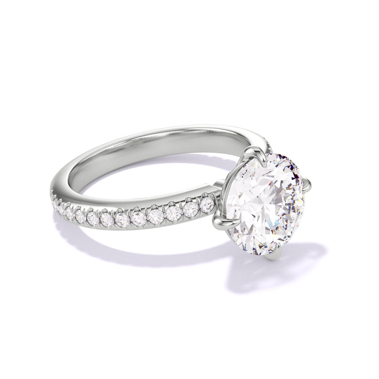 ROUND CUT DIAMOND ENGAGEMENT RING WITH A COMPASS 4 PRONG THREE PHASES PAVE SETTING IN PLATINUM