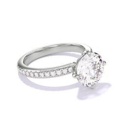 ROUND CUT DIAMOND ENGAGEMENT RING WITH A COMPASS 4 PRONG THREE PHASES PAVE SETTING IN PLATINUM