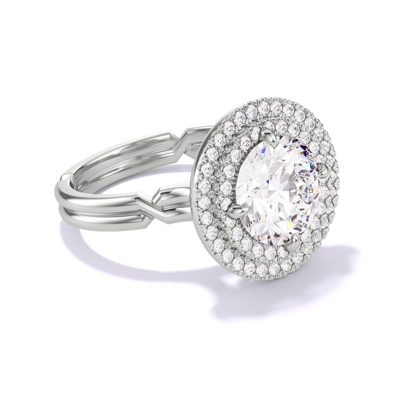 ROUND CUT DIAMOND ENGAGEMENT RING WITH A DOUBLE HALO CHANCE SETTING IN PLATINUM