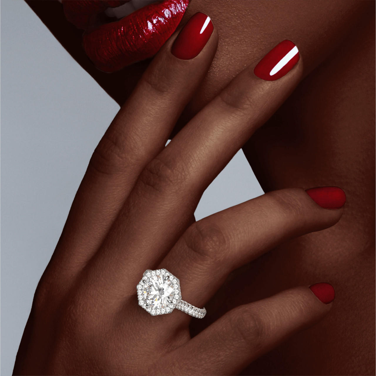 brilliant round diamond platinum engagement ring on hand