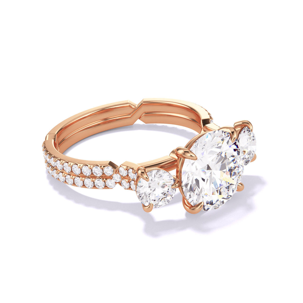 ROUND CUT DIAMOND ENGAGEMENT RING WITH A THREE STONE CHANCE PAVE SETTING IN 18K ROSE GOLD