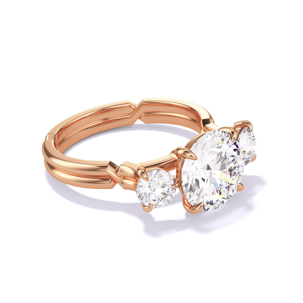 ROUND CUT DIAMOND ENGAGEMENT RING WITH A THREE STONE CHANCE SETTING IN 18K ROSE GOLD