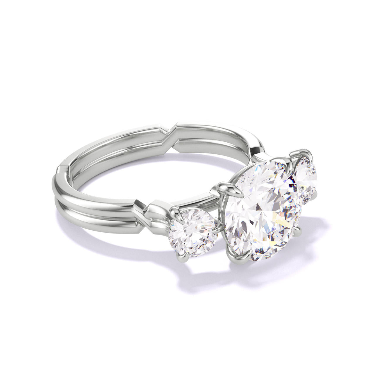 ROUND CUT DIAMOND ENGAGEMENT RING WITH A THREE STONE CHANCE SETTING IN PLATINUM