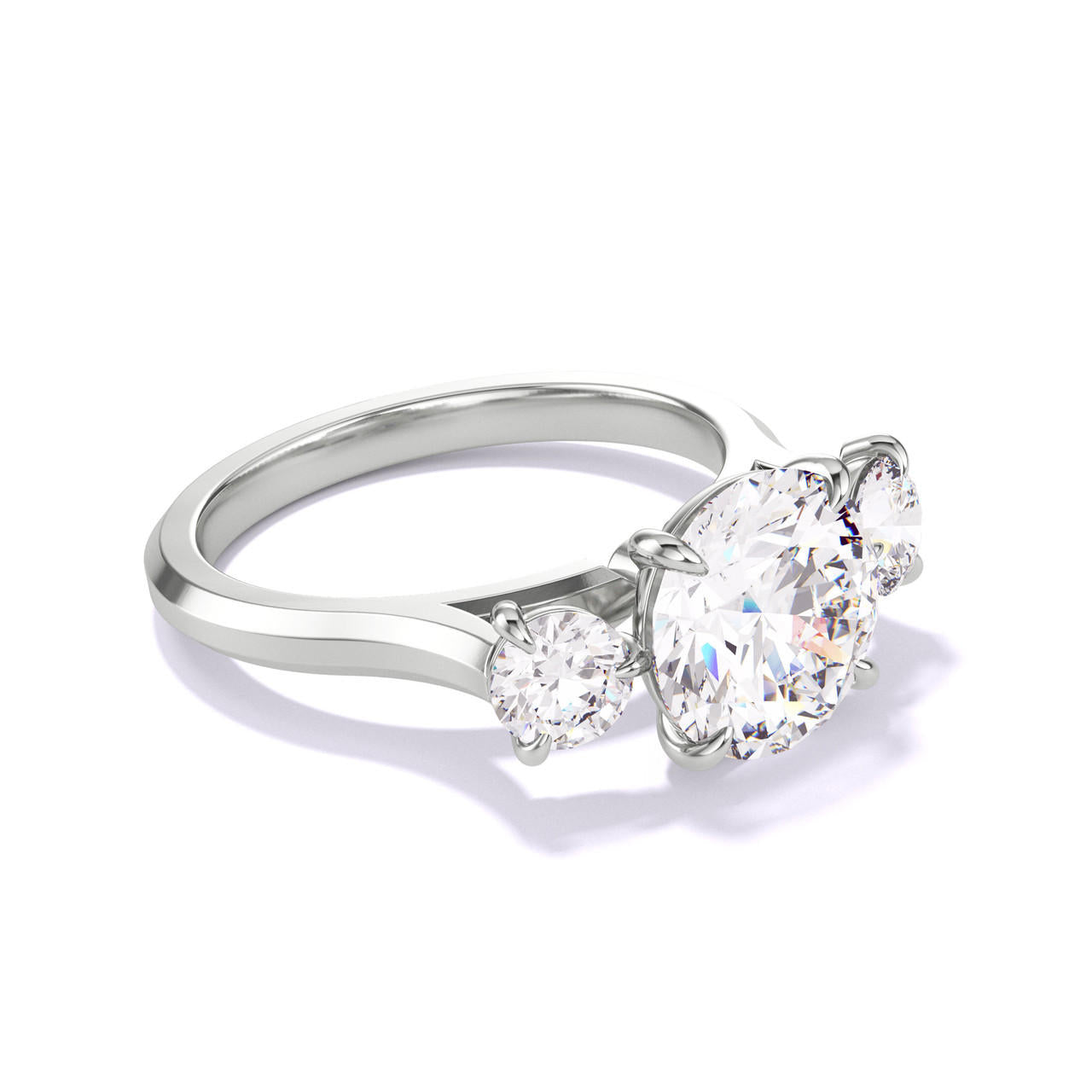 ROUND CUT DIAMOND ENGAGEMENT RING WITH A THREE STONE THREE PHASES SLIM SETTING IN PLATINUM