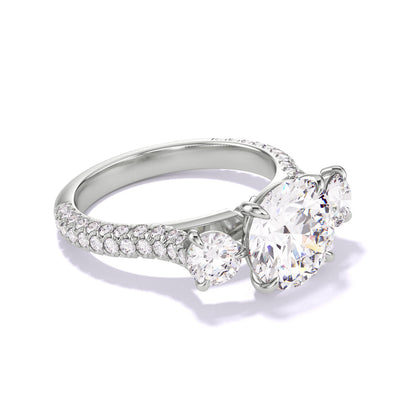 ROUND CUT DIAMOND ENGAGEMENT RING WITH A THREE STONE THREE PHASES TRIPLE PAVE SETTING IN PLATINUM