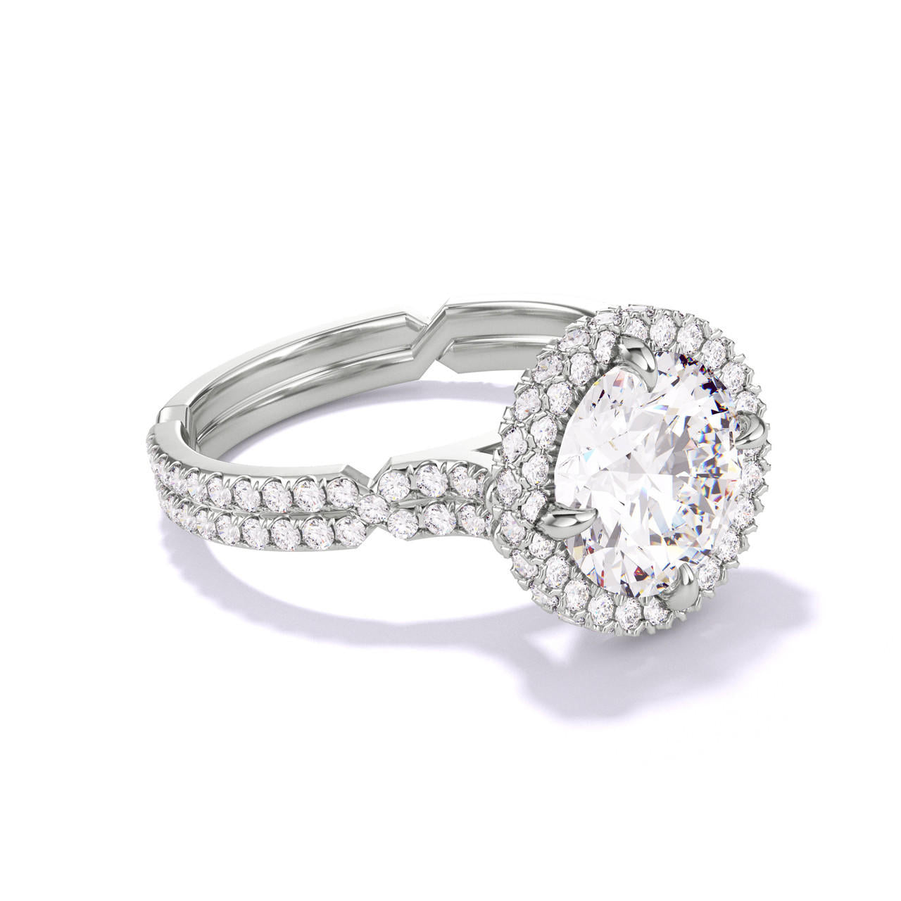 ROUND CUT DIAMOND ENGAGEMENT RING WITH A WRAPPED HALO CHANCE PAVE SETTING IN PLATINUM