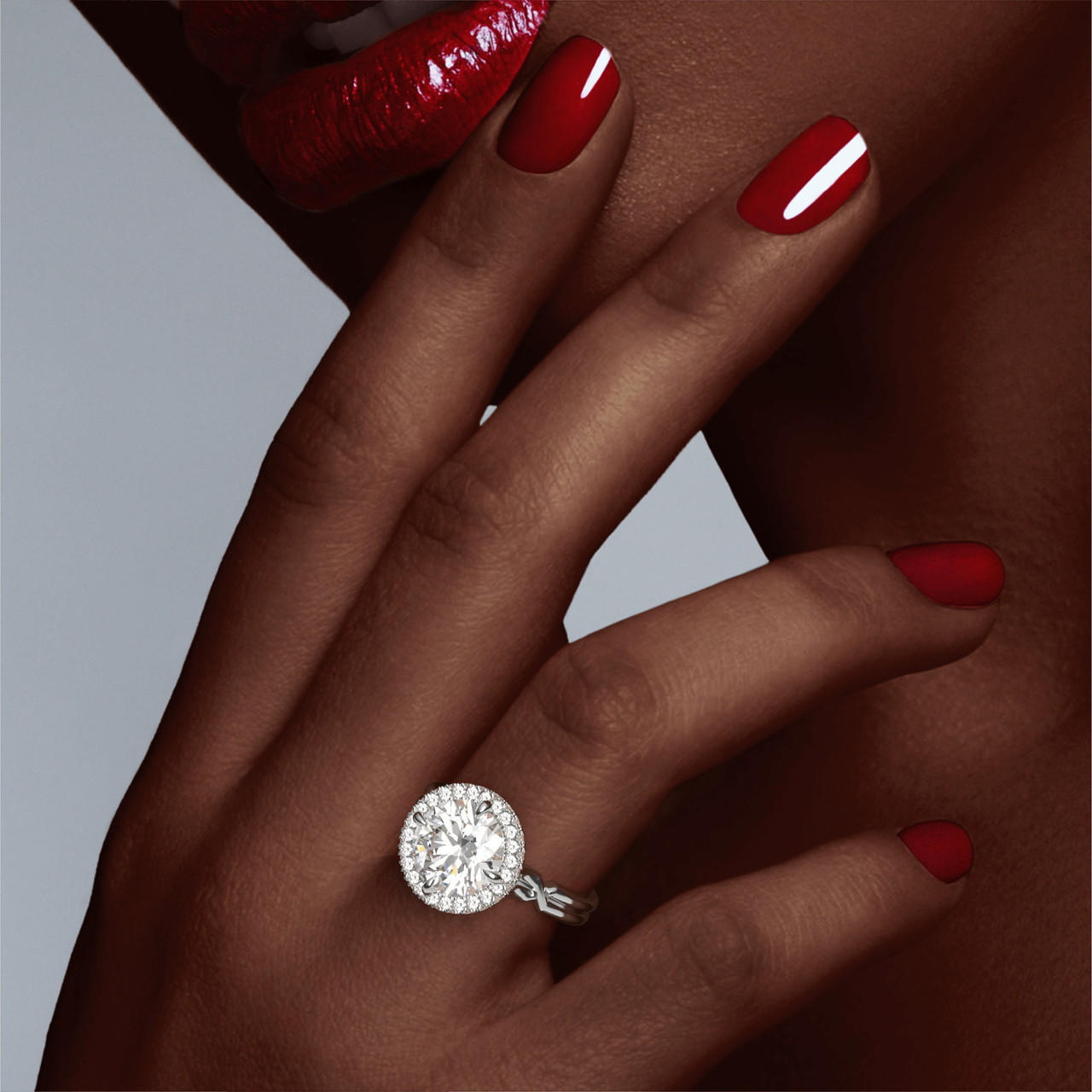 Platinum Round Engagement Ring with a Wrapped Halo Chance Setting on hand