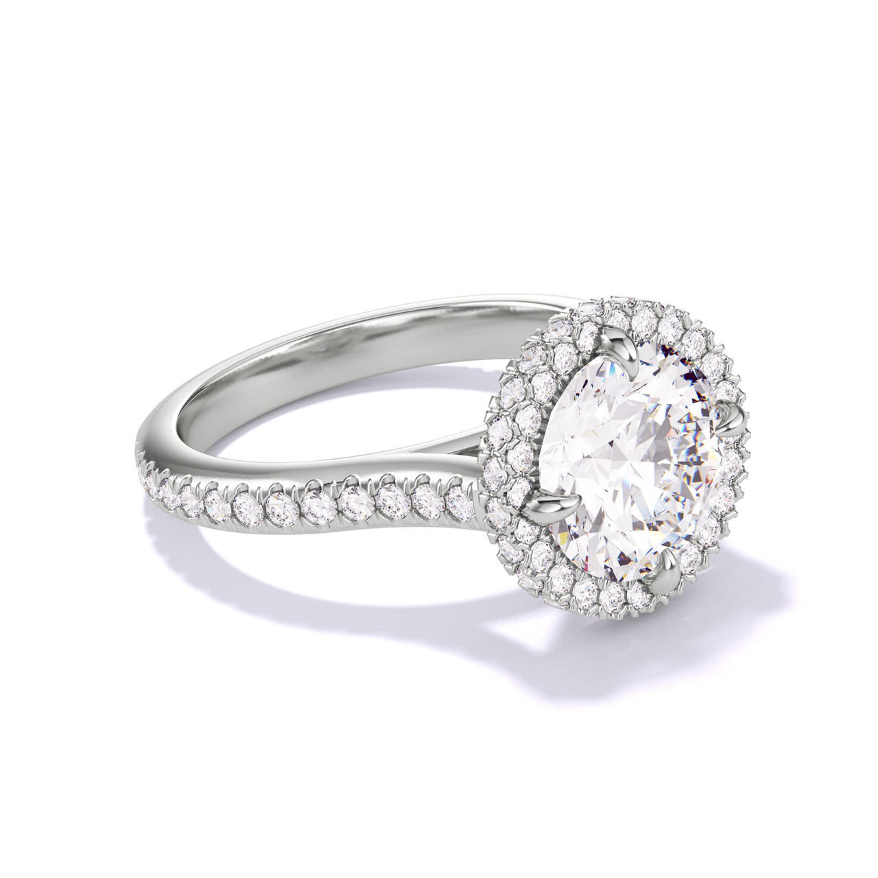 ROUND CUT DIAMOND ENGAGEMENT RING WITH A WRAPPED HALO THREE PHASES PAVE SETTING IN PLATINUM